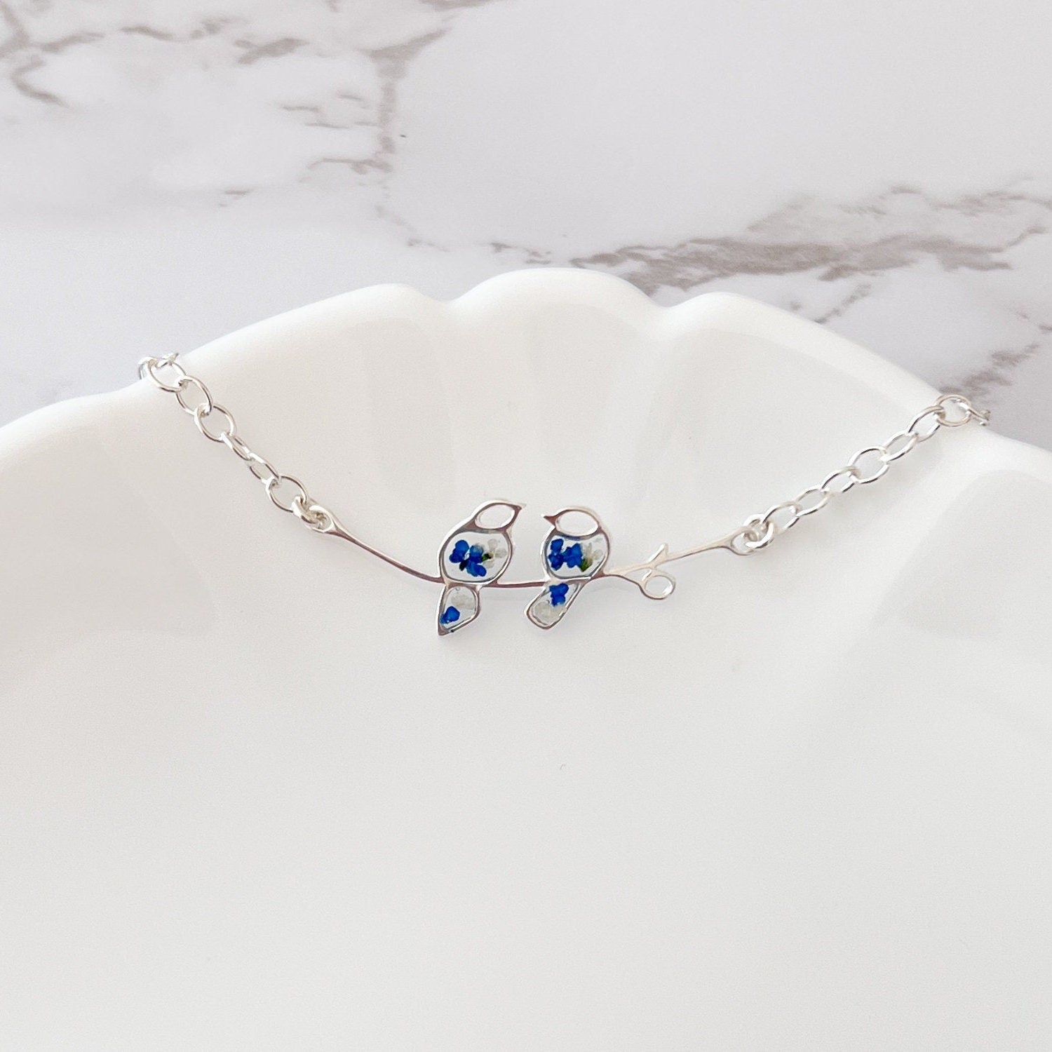 Glima Lovebird Bracelet – Sterling Silver with Real Flowers & Blue Bird Charm