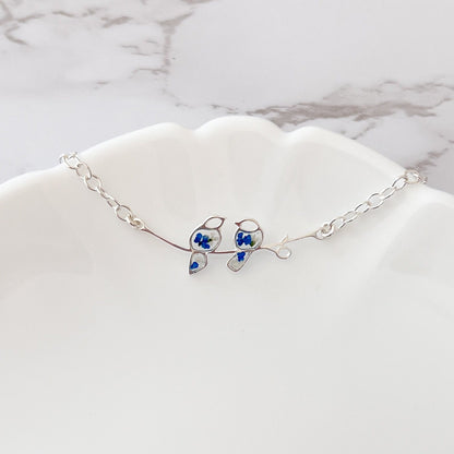 Glima Lovebird Bracelet – Sterling Silver with Real Flowers & Blue Bird Charm